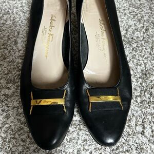 Black Salvatore Ferragamo 10.5 B small scratch on left toes.